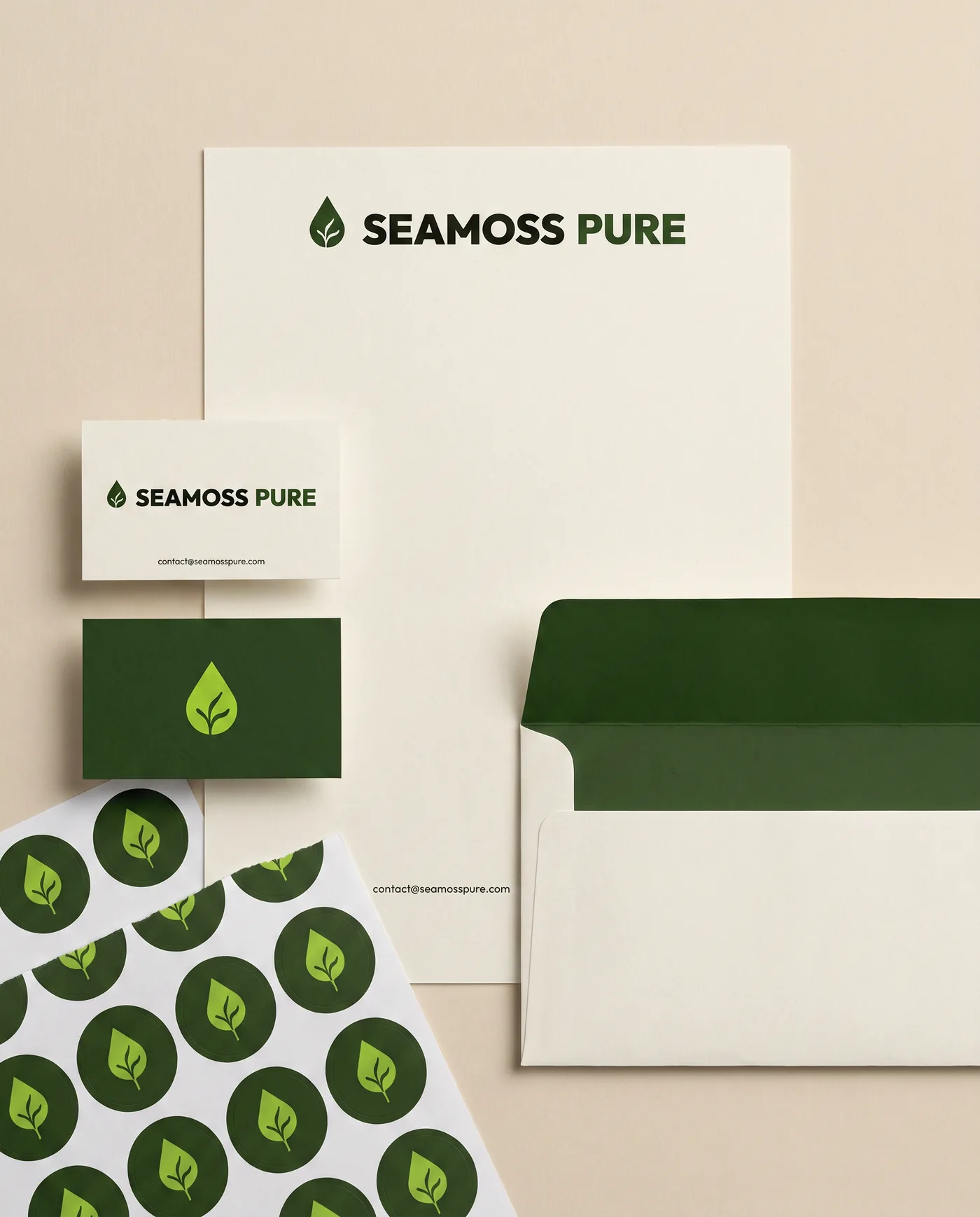 Letterhead, business cards, stickers and an envelope in olive and cream.